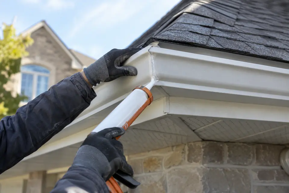Old damaged gutter removed from a residential fascia